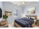 Virtually staged bedroom with natural light, neutral paint, and a large bed with coordinated linens at 127 Lakewood Circle Dr, Mooresville, NC 28117
