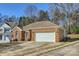 Exterior view of the brick home and garage at 127 Lakewood Circle Dr, Mooresville, NC 28117