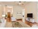 Virtually staged living room with wood floors and a modern aesthetic at 127 Lakewood Circle Dr, Mooresville, NC 28117