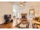 Spacious living room featuring a brick fireplace at 127 Lakewood Circle Dr, Mooresville, NC 28117