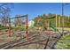 Neighborhood playground with swings, slides, and play equipment for enjoyment at 127 Lakewood Circle Dr, Mooresville, NC 28117