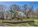 Community playground featuring slides, climbing structures, and a shaded seating area at 127 Lakewood Circle Dr, Mooresville, NC 28117