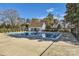Large community swimming pool with a bathhouse, surrounded by landscaping and fencing at 127 Lakewood Circle Dr, Mooresville, NC 28117