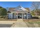 Pool house at community pool, featuring a welcoming entrance and signage at 127 Lakewood Circle Dr, Mooresville, NC 28117