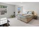Bedroom featuring a platform bed, neutral walls, and natural light from the windows at 13044 Cottage Crest Ln, Charlotte, NC 28273