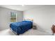 Bedroom featuring a metal bed frame, soft carpet, and natural light from the window at 13044 Cottage Crest Ln, Charlotte, NC 28273