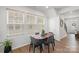 Cozy dining area with stylish decor, wood floors, and plenty of natural light at 13044 Cottage Crest Ln, Charlotte, NC 28273