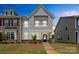 Charming two-story townhome featuring a well-manicured lawn and inviting front entrance at 13044 Cottage Crest Ln, Charlotte, NC 28273