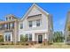 Inviting two-story townhome with a manicured lawn and charming front entrance at 13044 Cottage Crest Ln, Charlotte, NC 28273