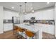 Modern kitchen features a spacious island, stainless steel appliances, and ample counter space at 13044 Cottage Crest Ln, Charlotte, NC 28273