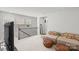 A cozy upstairs room with comfortable seating, plush carpet, and lots of natural light through large windows at 13044 Cottage Crest Ln, Charlotte, NC 28273