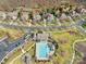 Gorgeous aerial view of a neighborhood with mature landscaping, a community pool, and well-maintained facilities at 13114 Long Common Pkwy, Huntersville, NC 28078
