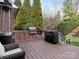 Back deck featuring an outdoor kitchen, grill, and manicured landscaping at 13114 Long Common Pkwy, Huntersville, NC 28078
