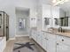 Bathroom featuring double vanity sinks, granite countertops, and a walk-in shower at 13114 Long Common Pkwy, Huntersville, NC 28078
