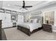 Main bedroom with built-in storage, ceiling fan, and natural light at 13114 Long Common Pkwy, Huntersville, NC 28078