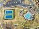 Aerial view of community amenities featuring tennis courts, a playground, and a swimming pool at 13114 Long Common Pkwy, Huntersville, NC 28078