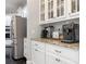 Kitchen area boasts granite countertops, stainless steel appliances, and stylish cabinetry at 13114 Long Common Pkwy, Huntersville, NC 28078