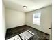A well-lit bedroom is displayed with light-colored walls, wood-style flooring, and a window at 1350 Russell St, Rock Hill, SC 29730