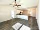 Bright, open-concept living room and kitchen area with modern flooring, lots of natural light, and white cabinets at 1350 Russell St, Rock Hill, SC 29730