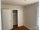 Bedroom features hardwood floors and sliding closet doors at 1610 India Hook Rd # 26, Rock Hill, SC 29732