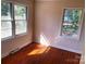 Bedroom has hardwood floors and two bright windows at 1610 India Hook Rd # 26, Rock Hill, SC 29732