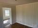 Cozy bedroom with soft neutral tones, beadboard walls and doorway views at 1610 India Hook Rd # 26, Rock Hill, SC 29732