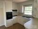 Bright kitchen featuring ample white cabinetry, and modern appliances at 1610 India Hook Rd # 26, Rock Hill, SC 29732