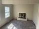 Warm living room featuring a cozy fireplace and soft carpeting at 1610 India Hook Rd # 26, Rock Hill, SC 29732