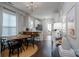 Open concept dining area adjacent to the kitchen with a stylish table, chairs, and modern lighting at 16619 Spruell St, Huntersville, NC 28078