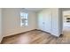 Cozy bedroom with wood floors, double closet doors, and a window with natural light at 1705 Wooten Way, Bessemer City, NC 28016