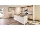 Modern kitchen with stainless steel appliances, gray cabinets, and a large island with sink at 1705 Wooten Way, Bessemer City, NC 28016