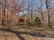 Backyard featuring a small playhouse with a wood fence surround at 2100 Winding Oaks Trl, Waxhaw, NC 28173