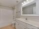 Neutral bathroom featuring a shower-tub combo and a white vanity with chrome fixtures at 2100 Winding Oaks Trl, Waxhaw, NC 28173