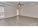 Spacious bedroom with tray ceiling, ceiling fan and natural light at 2100 Winding Oaks Trl, Waxhaw, NC 28173