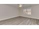 Bedroom featuring new vinyl flooring, fresh paint, and a ceiling fan at 2100 Winding Oaks Trl, Waxhaw, NC 28173