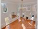 Open floor plan showcases large windows and a fireplace at 2100 Winding Oaks Trl, Waxhaw, NC 28173
