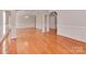 Spacious living room boasts hardwood floors, decorative trim, and ample natural light at 2100 Winding Oaks Trl, Waxhaw, NC 28173