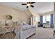 A cozy bedroom featuring a bed frame and furniture, plus a desk area near the window at 2172 Paddlers Cove Dr, Clover, SC 29710