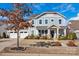 Charming two-story home with welcoming front porch, beautiful landscaping, and two-car garage at 2172 Paddlers Cove Dr, Clover, SC 29710