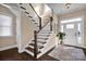 Elegant foyer with hardwood floors, staircase, and a bright entryway at 2172 Paddlers Cove Dr, Clover, SC 29710