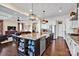 Open concept kitchen and living room with a large center island and stylish decor at 2172 Paddlers Cove Dr, Clover, SC 29710