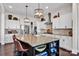 Gourmet kitchen featuring a center island with seating, stainless steel appliances, and stylish pendant lighting at 2172 Paddlers Cove Dr, Clover, SC 29710