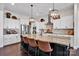 Modern kitchen featuring a large island, stainless steel appliances, and custom cabinetry at 2172 Paddlers Cove Dr, Clover, SC 29710