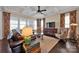 Inviting living room with coffered ceiling, plush seating, and large windows at 2172 Paddlers Cove Dr, Clover, SC 29710
