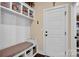 Functional mudroom with a bench, storage shelves, and easy access to the outdoors at 2172 Paddlers Cove Dr, Clover, SC 29710