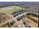 Aerial view of the neighborhood showcasing a blend of homes, ponds, and community amenities at 2172 Paddlers Cove Dr, Clover, SC 29710