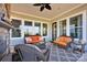 A covered patio offers comfortable seating, a fireplace, and a view of the surrounding landscape at 2172 Paddlers Cove Dr, Clover, SC 29710