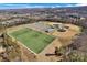 Aerial view showcasing community sports fields with baseball diamonds, soccer fields, and parking at 2172 Paddlers Cove Dr, Clover, SC 29710