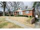Charming brick home featuring a well-maintained lawn and a sidewalk leading to the front door at 3039 N Center St # 10/C, Hickory, NC 28601