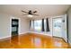 Bright living room featuring hardwood floors, neutral walls, and natural light from large windows at 3039 N Center St # 10/C, Hickory, NC 28601